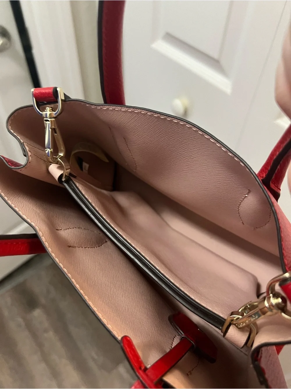 kate spade red leather satchel with top handles and adjustable crossbody strap